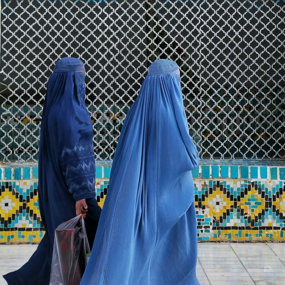 Two Women in Burqa Walking past Hazrat Ali Mazar Mosque in Mazar-i-Sharif, Afghanistan